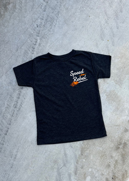 Black t-shirt with 'Speed Rebel' text on a gray concrete surface